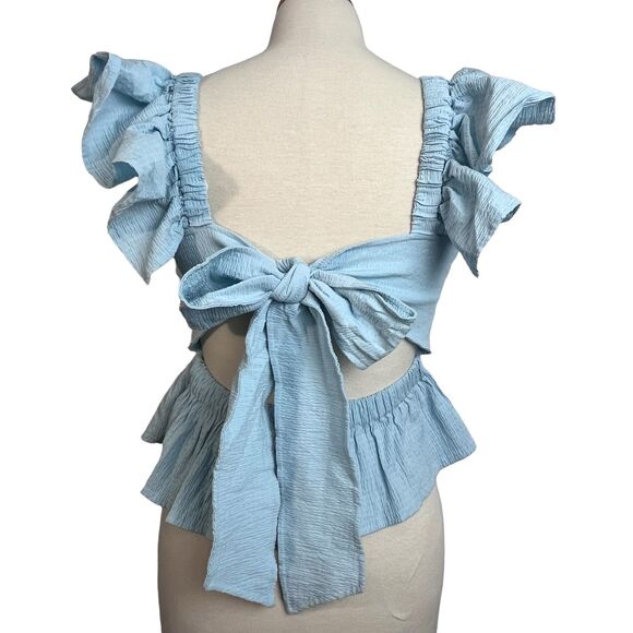 Anisa Peplum Jessie Bow Back Blouse in Light Blue by Francesca’s - Picture 10 of 16